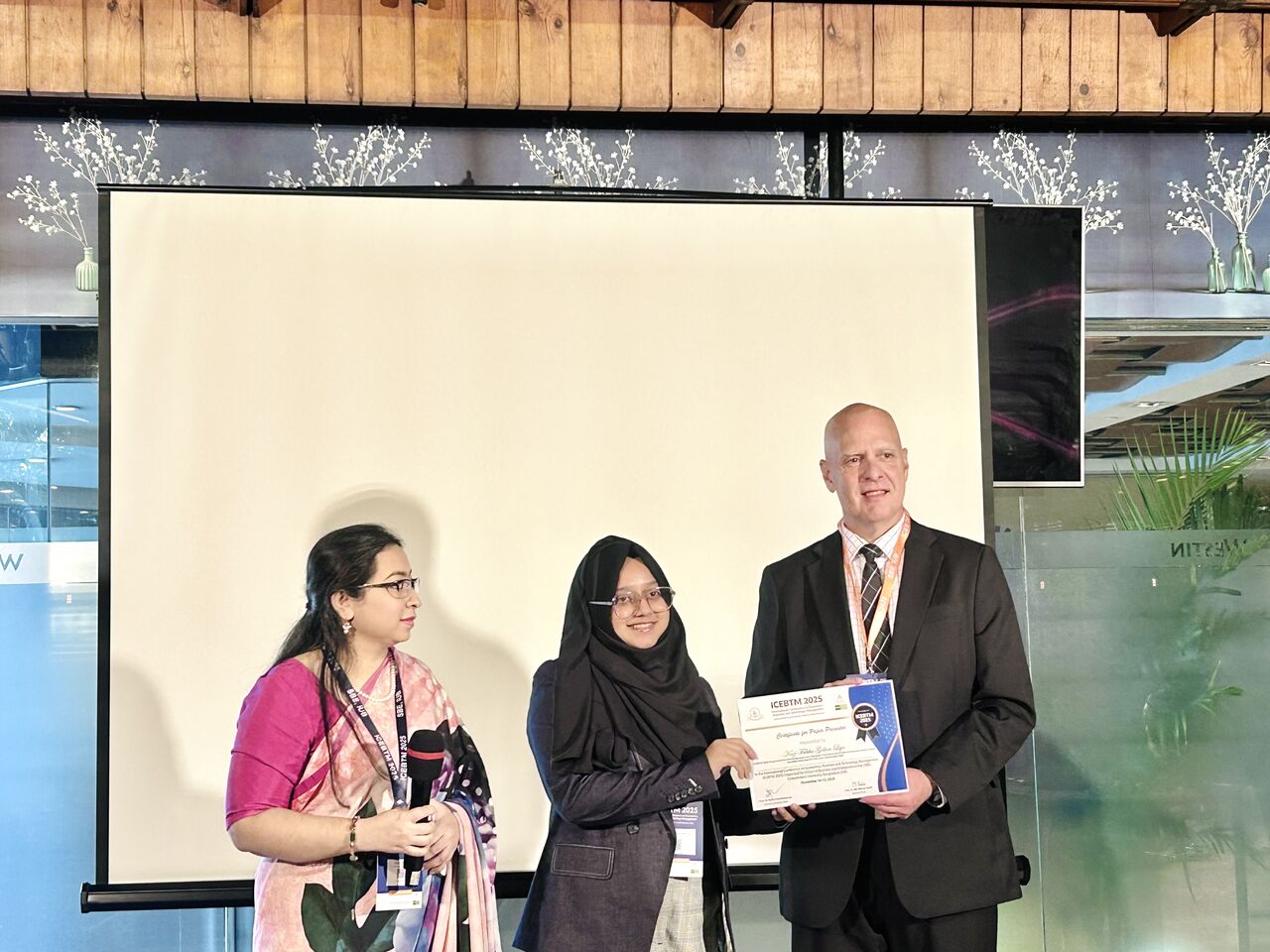 Kazi Fabiha Golam Liya receiving a certificate at ICEBTM 2025